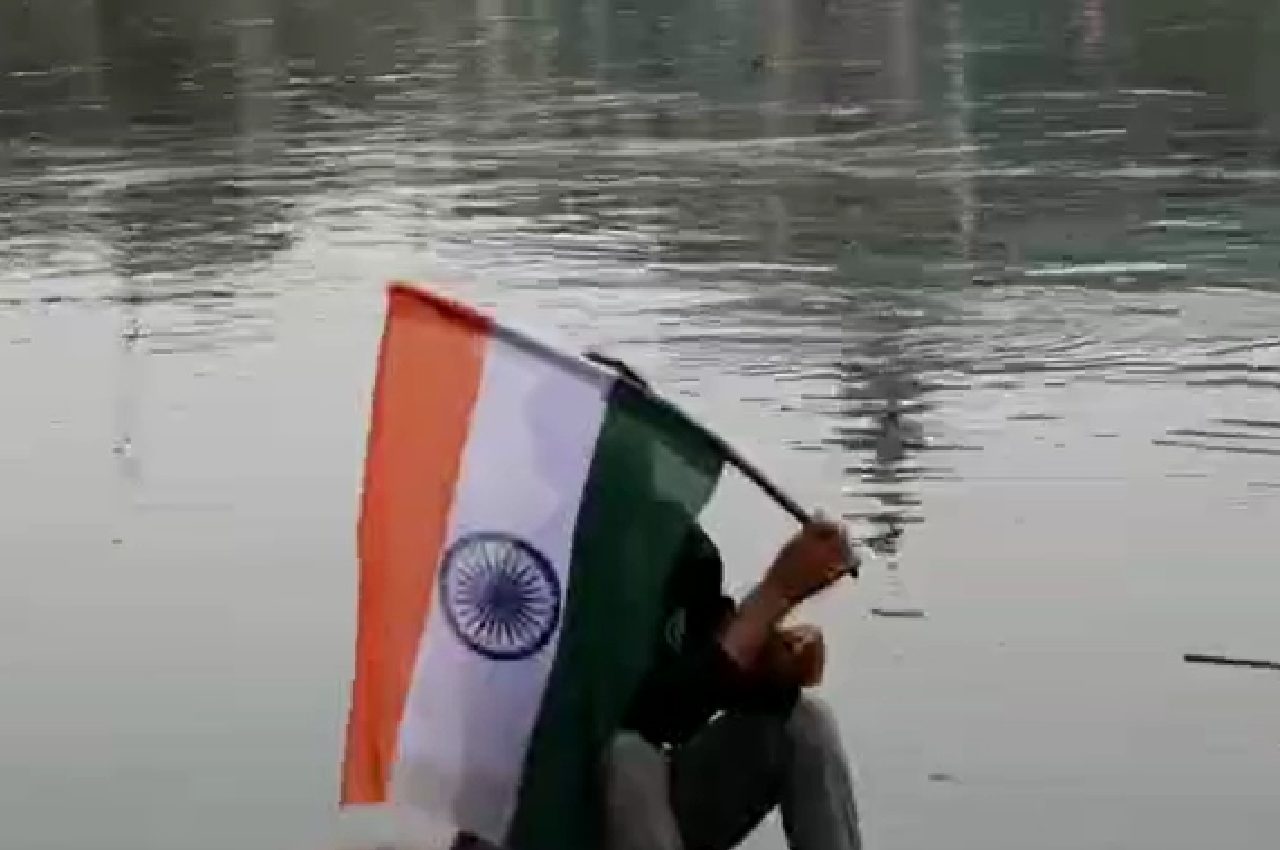 Boats sail with National Flag