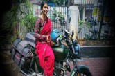 woman on bike in saree