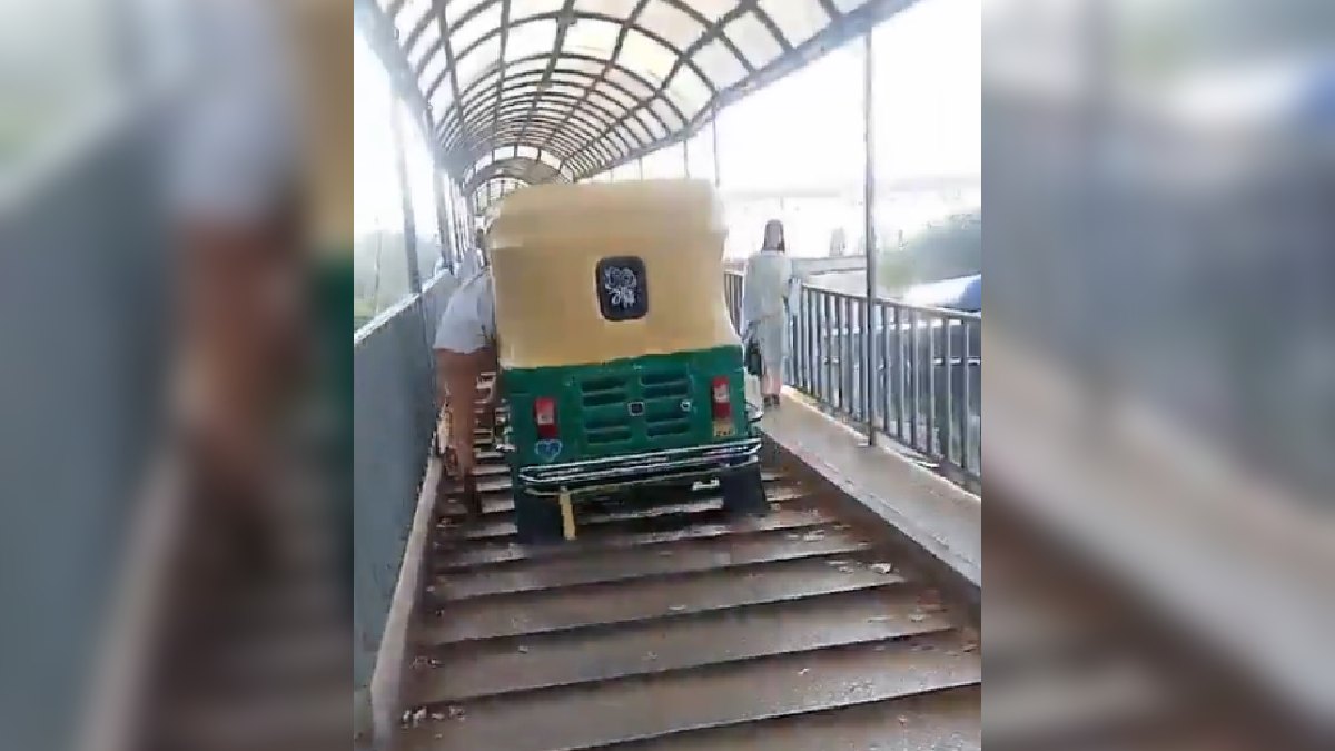 Screengrab of video showing Auto driver riding through the foot-over bridge to avoid traffic jam. (Photo Credit: X/@boredjourno)