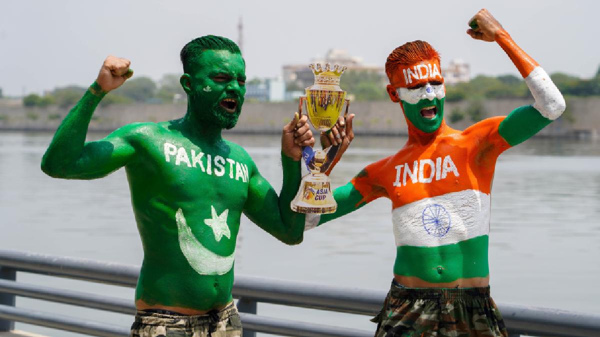 People painted in India and Pakistan flags pose for a picture ahead of the Asia Cup 2023 match between India and Pakistan in Sri Lanka, in Ahmedabad on Friday. (Photo Credit: ANI)