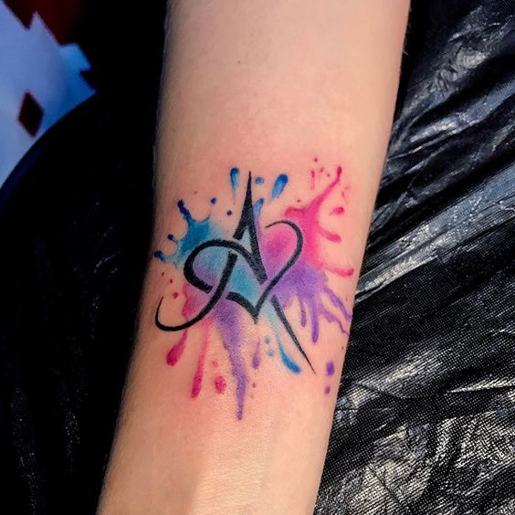 Infinity tattoo includes a feather & paw print