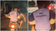 Man carrying crocodile on scooter in Vadodara amid flood