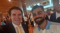 Tim Watts and Virat Kohli