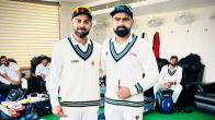 Virat Kohli with Railways' fast bowler Himanshu Sangwan