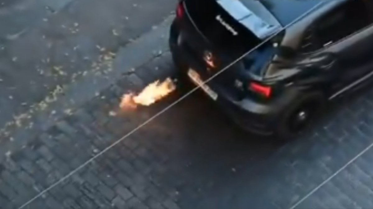 WATCH: Car Emits Flames On Bengaluru’s Church Street, Pedestrians Left Shocked!