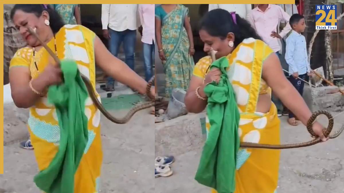Sankes Bites Woman Snake bites woman on face while trying to catch a hold of his fangs